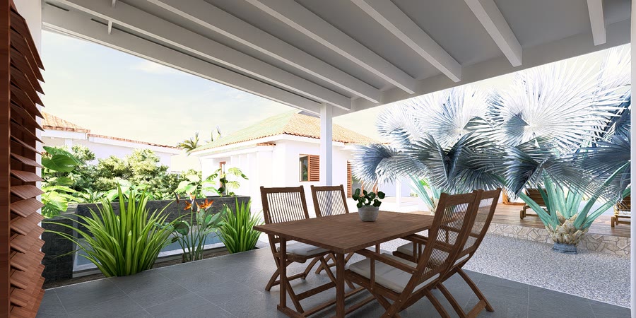 Covered veranda with wooden dining table